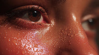 a close up image captures a human face with water droplets on it highlighting the individual s features and the droplets - Stock Video