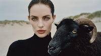 A Woman Stands In A Desert Landscape Holding A Sheep — Stock Photo