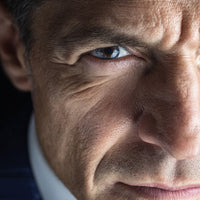 A Close Up Portrait Of A Man With An Intense Gaze Looking Directly Into The Camera — Stock Photo