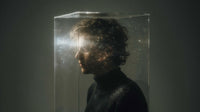 A Man S Head Is Encased Within A Large Transparent Cube Shaped Structure Which To Be Made Of Clear Plastic Glass — Stock Photo