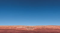 Presents A Striking View Of A Rocky Cliff Face With A Clear Blue Sky In The Background — Stock Photo