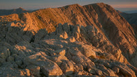 rocky mountain sunset with rugged terrain and clear sky - Stock Video
