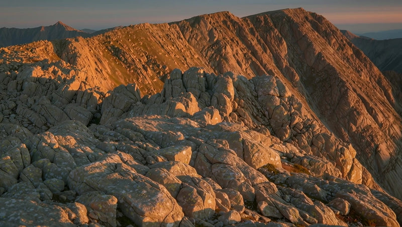 rocky mountain sunset with rugged terrain and clear sky - Stock Video