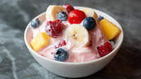 A Bowl Of Fruit Yogurt Parfait With Blueberries Bananas And A Drizzle Of Honey — Stock Photo
