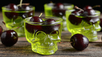 Displays A Collection Of Cherry Bomb Cocktails Each Served In Skull Shot Glasses Arranged On A Surface — Stock Photo