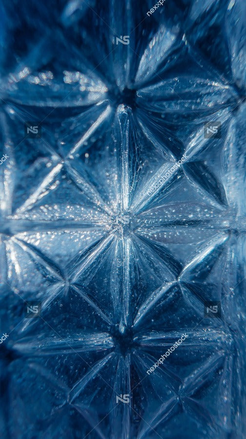 Transparent Ice Sculpture With Intricate Patterns And Facets Showcasing Its Sparkling Clarity Against A Dark Background — Stock Photo