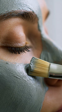 A Close Up Photograph Focusing On A Person S Face With Their Eyes Closed Receiving A Facial Treatment — Stock Photo