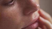 Woman With Freckles In Close Up — Stock Photo