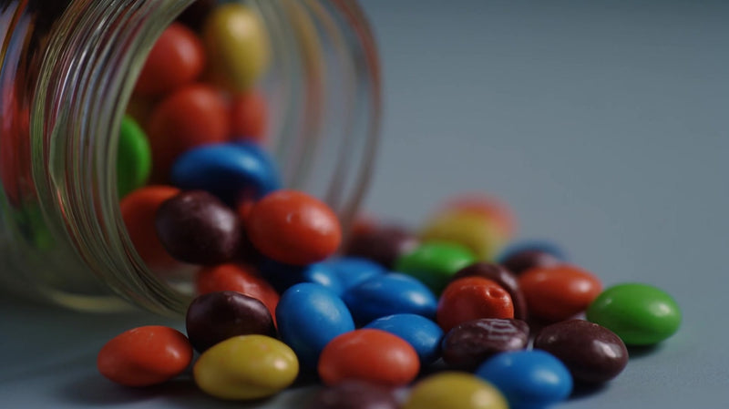colorful candy in jar - Stock Video
