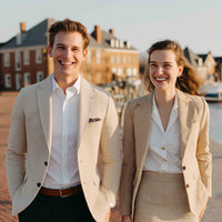 Shows Two Individuals Standing Outdoors In Front Of A Building With Brickwork And A Wooden Fence — Stock Photo
