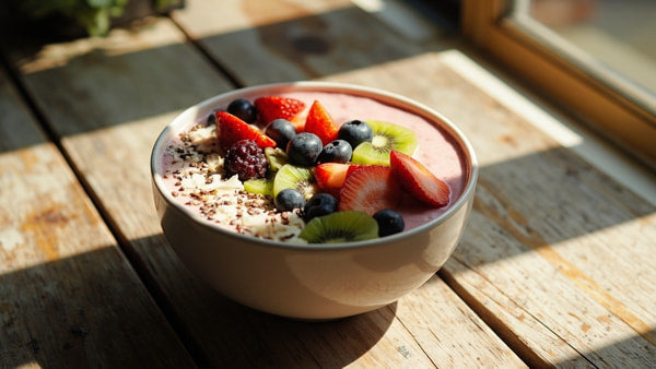 A Bowl Of Fruit Smoothie With Berries And Nuts Placed On A Wooden Table — Stock Photo