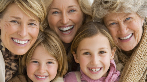 A Family Portrait With A Group Of People Smiling And Posing Together Taken In A Studio Setting — Stock Photo
