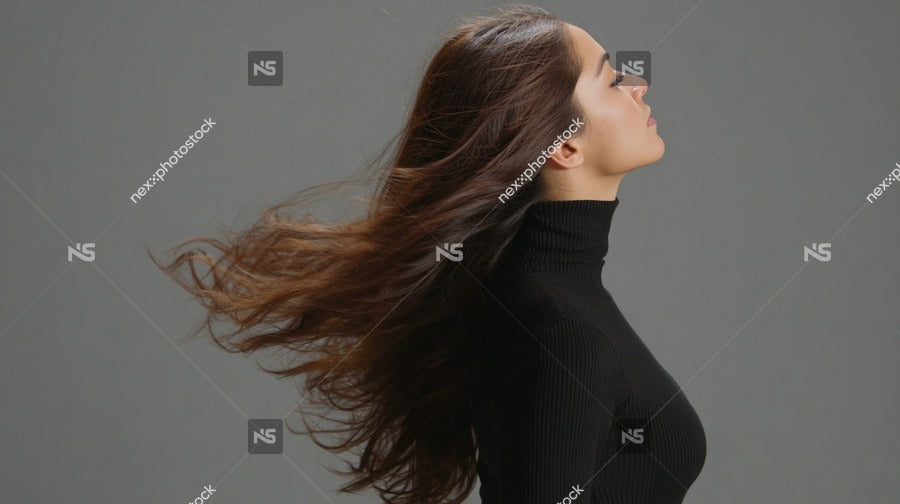 A Woman With Long Hair Is Captured In A Portrait Style Image Showcasing Her Flowing Locks Against A Neutral Background — Stock Photo