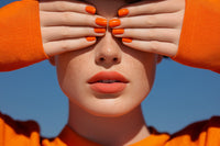 A Portrait Of A Person With Their Hands Covering Their Eyes And Holding Up A Finger To Block Out Light — Stock Photo