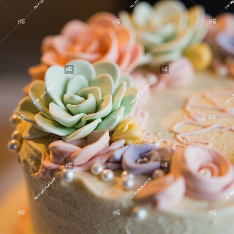 Colorful Cake Adorned With Fondant Flowers And Intricate Icing Designs Presented On A Table — Stock Photo