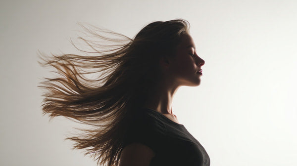 A Woman With Long Hair Captured In Motion Creating A Dynamic And Portrait Against A White Background — Stock Photo