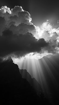 A Black And White Photograph Captures A Sunbeam Piercing Through Clouds Casting A Striking Contrast Against The Dark Sky — Stock Photo