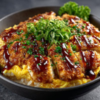 Close Up Of A Plate Of Chicken Katsu With Sauce And Garnish On A Dark Background — Stock Photo