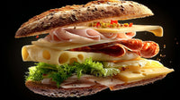 a large gourmet sandwich filled with deli meats and cheese served on a toasted bun with lettuce and tomato - Stock Video