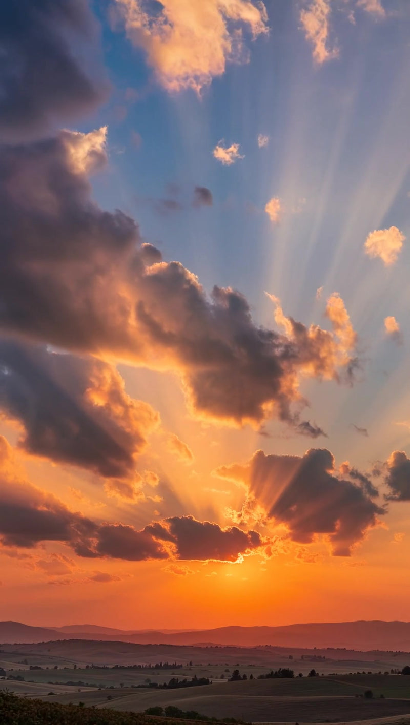 captures a breathtaking sunset scene with clouds and rays of sunlight piercing through them - Stock Video