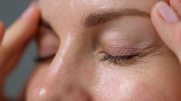 A Close Up Portrait Of A Person With Their Eyes Closed And Hands Placed On Their Forehead — Stock Photo