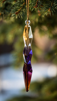 A Colorful Glass Ornament Hanging From A Pine Branch A Crystal Ball In Shades Of Blue And Purple — Stock Photo