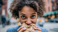 A Young Woman Enjoying A Snack In An Urban Setting — Stock Photo