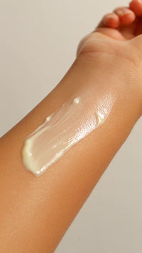 shows a close up view of a person s arm with a creamy substance applied to it - Stock Video