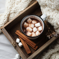 A Cozy Winter Drink Scene With A Hot Chocolate Beverage Marshmallows Cinnamon Sticks And A Warm Blanket In The Background — Stock Photo
