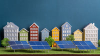 A Miniature Model Of A Neighborhood With Houses And Solar Panels Set Against A Blue Background — Stock Photo