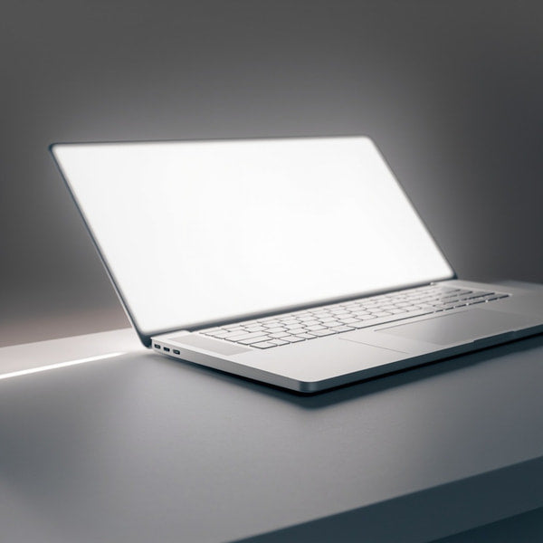 A Silver Laptop Computer Is Prominently Displayed On A Table With Its Screen Facing Towards The Viewer — Stock Photo