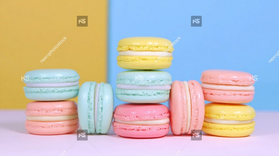 Displays A Collection Of Macarons With Colorful Fillings Stacked In A Visually Appealing Manner On A Surface Against A Blue Background — Stock Photo