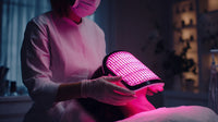 Shows A Person In A White Lab Coat Holding A Device With A Pink Light Over A Person S Head — Stock Photo