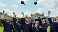 graduates celebrating with caps and gowns - Stock Video