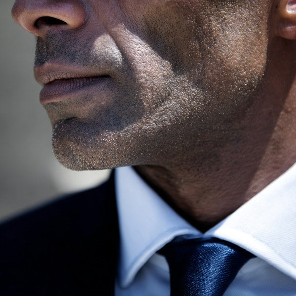 A Man With A Beard Wearing A Suit And Tie Is Captured From Two Different Angles — Stock Photo