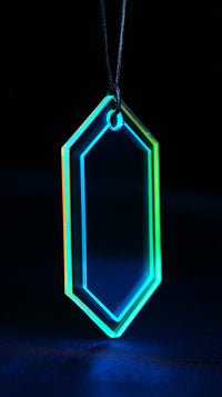 Neon Geometric Pendant With A Hexagonal Shape And Blue Background — Stock Photo