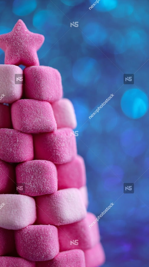 Colorful Christmas Tree Made Of Pink Marshmallows And Candy Canes Against A Blue Bokeh Background — Stock Photo