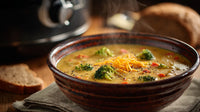 A Bowl Of Warm Broccoli Soup With Bread On The Side Placed On A Wooden Table — Stock Photo