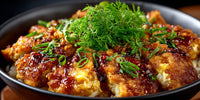 A Plate Of Chicken And Rice Topped With A Sauce And Garnished With Parsley — Stock Photo