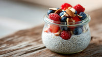 A Jar Of Raspberry Yogurt Parfait With Granola And Berries On A Wooden Table — Stock Photo