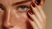 A Close Up Portrait Of A Woman Showcasing Her Freckles With A Focus On Her Eyes And The Application Of Nail Polish — Stock Photo