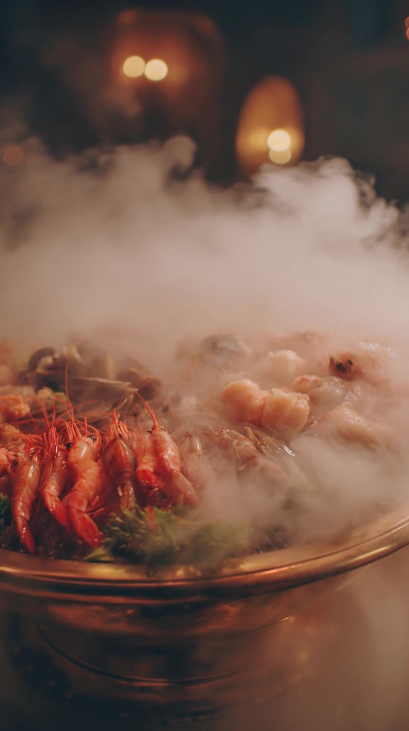 shows a large bowl filled with a seafood dish crayfish lobster placed on a table - Stock Video