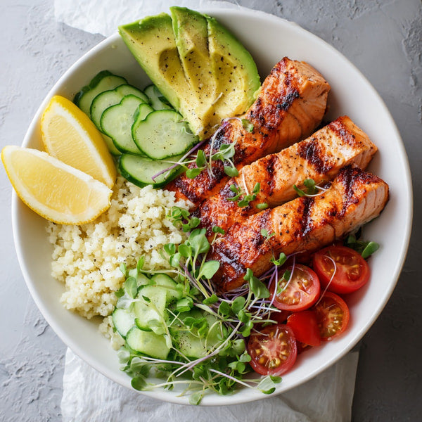 Grilled Salmon Bowl With Quinoa Avocado Cucumber Lemon Wedges And A Side Of Rice — Stock Photo