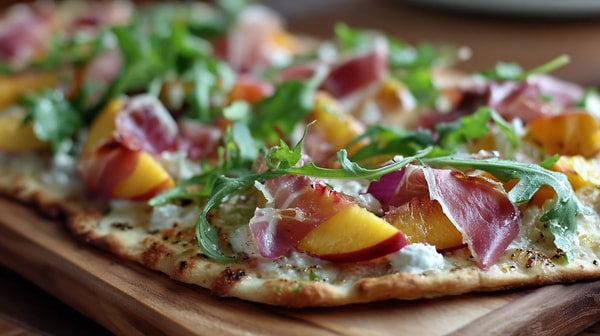 A Gourmet Pizza Topped With Fresh Ingredients Including Sliced Peaches And Cilantro Leaves On A Wooden Cutting Board — Stock Photo