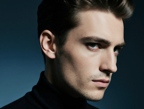 A Portrait Of An Actor Captured In A Close Up Shot Against A Blue Background — Stock Photo