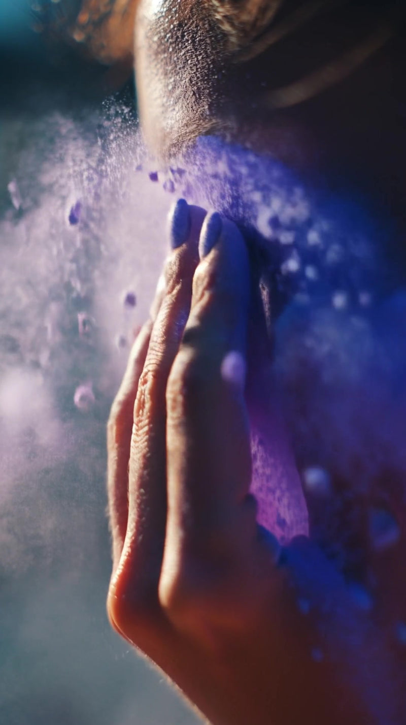 a woman s face is captured in a close up shot with dust particles visible in the air around her - Stock Video