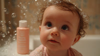 A Baby Sitting In A Bathtub Filled With Bubbles Looking Directly At The Camera — Stock Photo