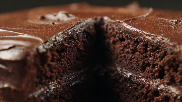 A Slice Of Chocolate Cake With A Visible Filling Captured From An Overhead Perspective — Stock Photo