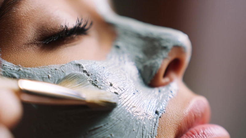a woman applying a facial mask with a brush captured in two different perspectives - Stock Video