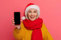 A Woman Wearing A Red Scarf And A Santa Hat Is Holding Up A Smartphone To Take A Selfie — Stock Photo